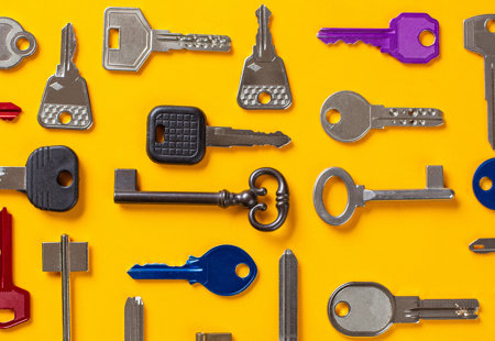 photo of lots of different keys, in different orientations, laid out on a yellow surface