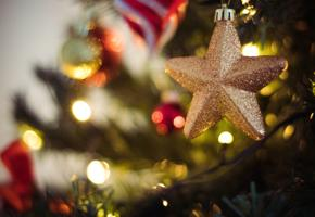 A close up of a Christmas bauble shaped like a star.
