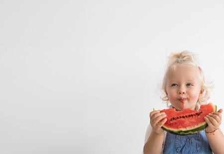 Little Girl Eating A Watermelon