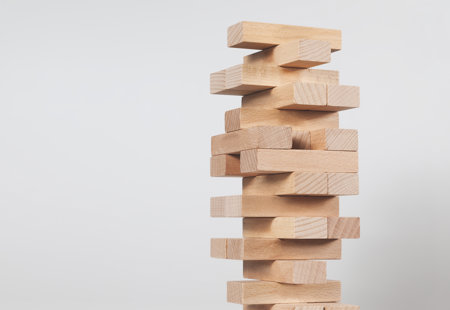 close-up of wooden blocks stacked for a game of jenga