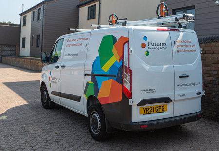 Futures van parked outside a building