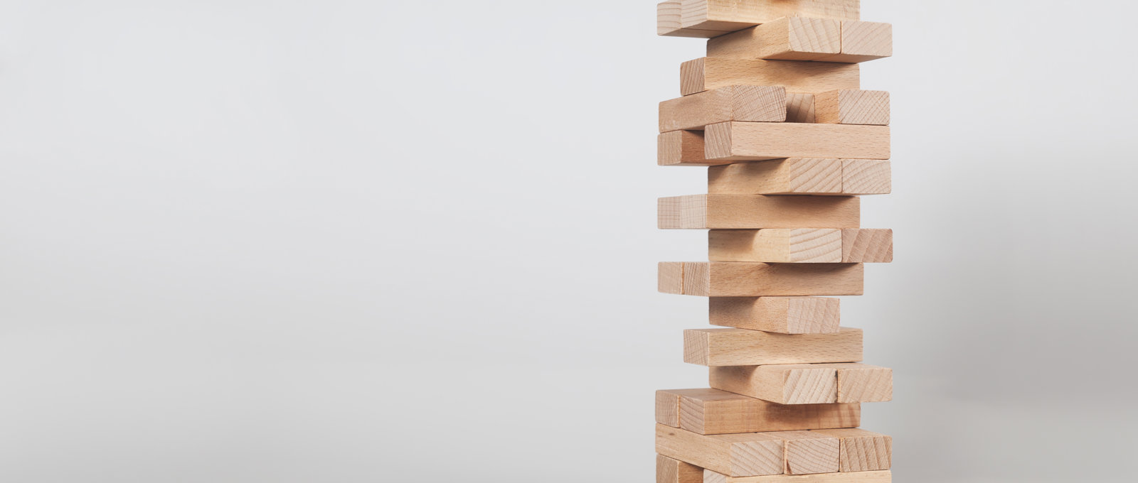 Tower of small wooden bricks
